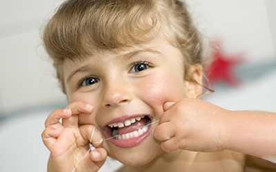 A child flossing