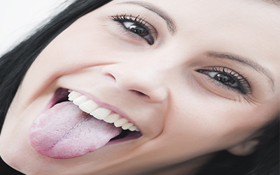 A close up of a woman sticking her tongue out